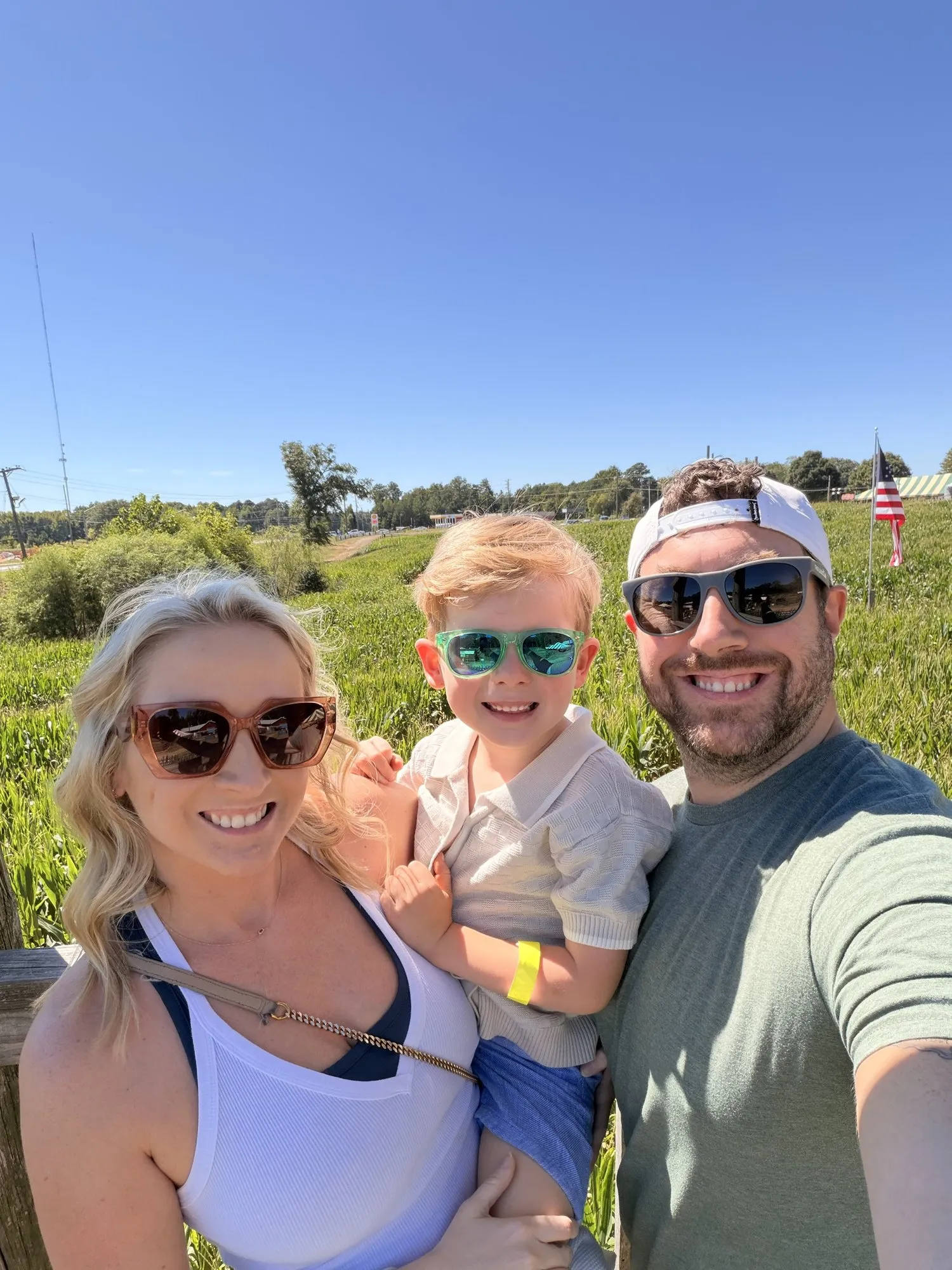 Samantha, Chris, and their son at a corn maze